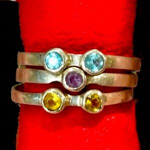 Elegant Silver Stacked Rings with Blue, Purple, and Yellow Stones
